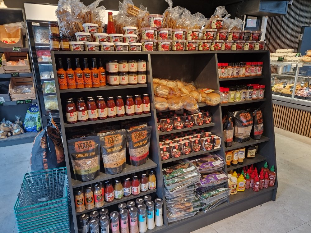 Shelves of rubs, sauces, smoking chips and fresh breads at Faulkner Butchery